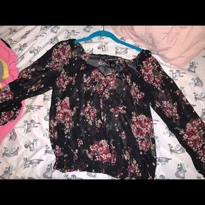 A black shirt with flower prints